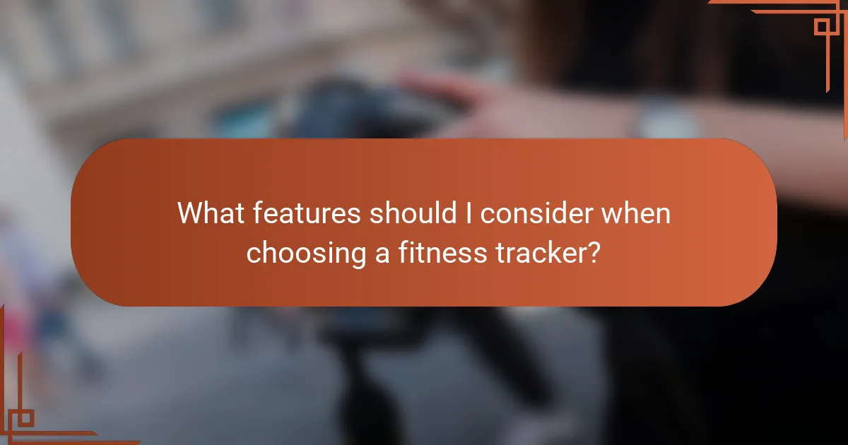 What features should I consider when choosing a fitness tracker?